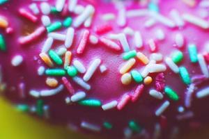 pink donut on a yellow background close photo