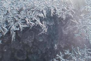 snow pattern on the glass from frost photo