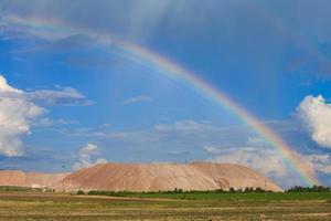 Soligorsk mountains. potash plant. Potash mountains near Soligorsk City. rainbow in the sky photo