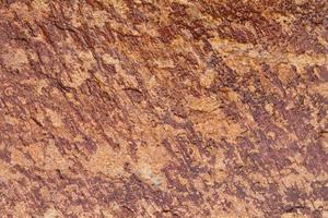 Mountain rock texture. Natural brown slate granite slab marble stone ceramic seamless tile rough surface background. Architecture grunge modern abstract style element. Close-up, copy space photo