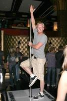 Jake Busey Showing his moves on a stripper pole made by Platinum StagesGBK MTV Movie Awards Gifting Suites Crimson  OperaLos Angeles  CAMay 30 20082008 photo
