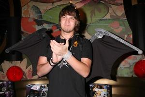 Scott Michael Foster wearing a pair of play Batman wings from Mattel promoting the Dark Knight movieGBK MTV Movie Awards Gifting Suites Crimson  OperaLos Angeles  CAMay 31 20082008 photo
