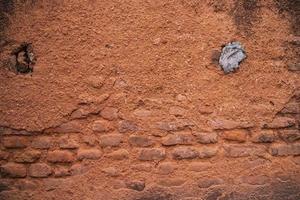 Old  brick wall red plaster texture can be used as a background wallpaper photo