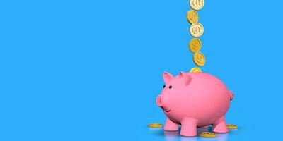 Gold coins falling into pink ceramic piggy bank standing against blue background photo