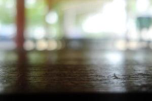 Close up Surface of Old Wooden Table in Cafe with Bokeh Background. photo