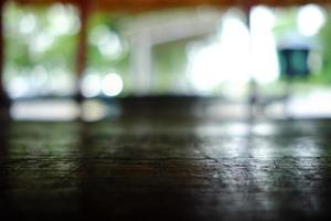 Close up Surface of Old Wooden Table in Cafe with Bokeh Background. photo