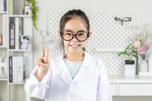 smart doctor Little Girl with white medical coat photo