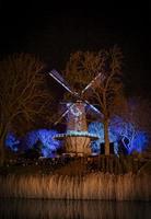 Old illuminated windmill photo