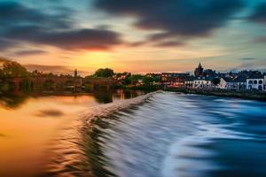 The River Nith and old bridge at sunset in Dumfries, Scotland. photo