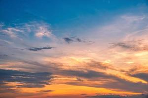 Beautiful cloudscape and dramatic sunset over mountain and sea. photo