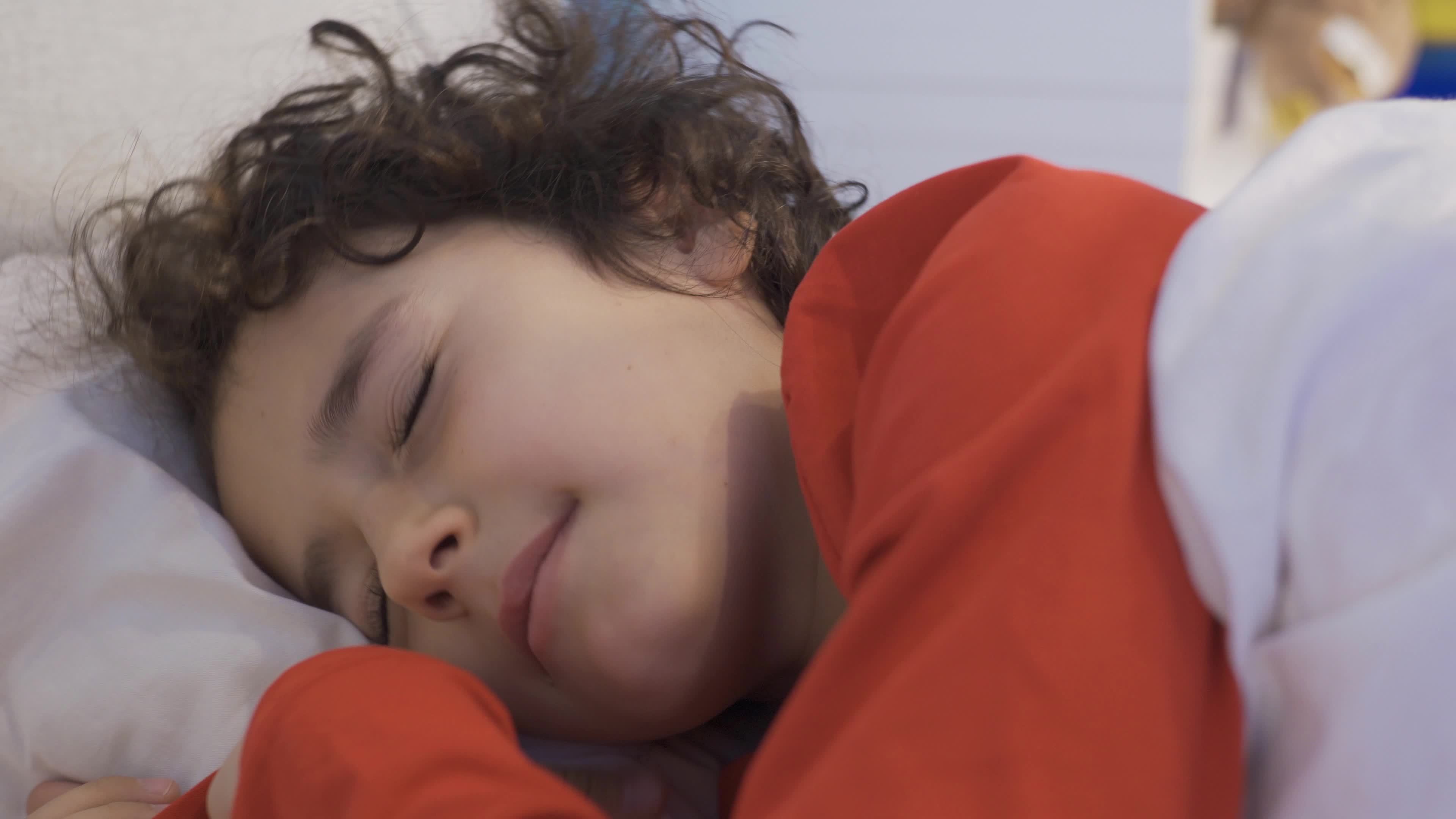 A boy with sleep problems can't sleep. Insomnia. The boy lying in the