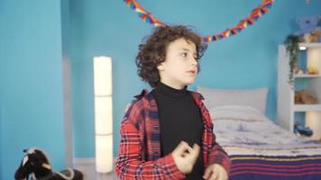 Close-up of boy doing calculations making plans in his head. Handsome and cute boy is having an idea in his children's room, thinking, calculating. video