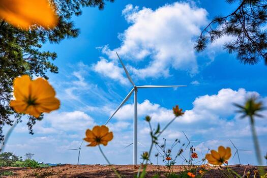 Wind turbines on mountain with blue sky and branch tree in Thailand. photo