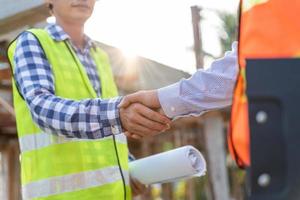inspector engineer and owner project is inspecting construction and quality assurance new house. Engineers or architects or contactor work to build the house before handing it over to the homeowner photo