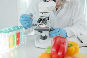 Scientist check chemical fruit residues in laboratory. Control experts inspect the concentration of chemical residues. hazards, standard, find prohibited substances, contaminate, Microbiologist photo