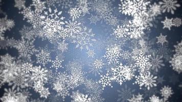 Beautiful ornate winter snowflakes and snow particles on blue background. This Winter, Christmas motion background is a seamless loop. video
