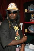 T Pain trying on a Grace Hat at the BET Awards GBK Gifting Lounge outside the Shrine Auditorium in Los Angeles CA onJune 22 20082008 photo