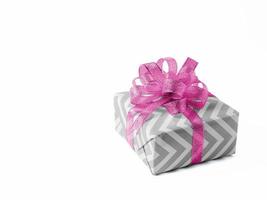 Surprise gift with a pink bow on white background. Isolate. photo