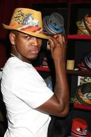 NeYo trying on a Grace Hat at the BET Awards GBK Gifting Lounge outside the Shrine Auditorium in Los Angeles CA onJune 22 20082008 photo