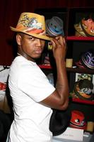 NeYo trying on a Grace Hat at the BET Awards GBK Gifting Lounge outside the Shrine Auditorium in Los Angeles CA onJune 22 20082008 photo