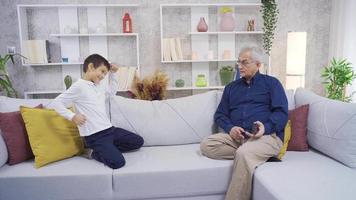 Father and son dancing at home. The little boy calls out to his father and they are having fun dancing. video