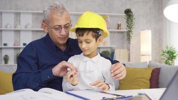 Little Son helps his father with his business. The younger son is helping his engineer father. video