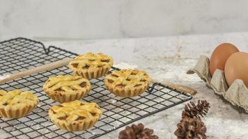 Small apple pie served on a cake rack, tastes sweet and savory. Food concept photo. photo