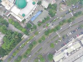 aerial view of the Darusalam mosque on the side of the highway. photo