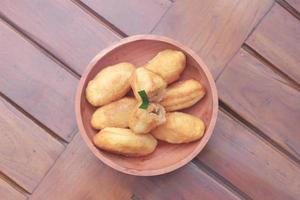 Comro or combro, a traditional Javanese snack made of deep fried grated cassava filled with a savory mix of oncom or fermented soy bean cake and chili photo