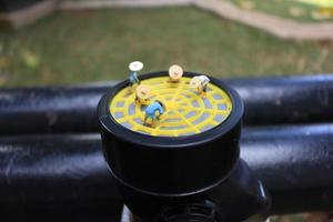 photo of a miniature figure with the concept of a farmer farming on a respirator.