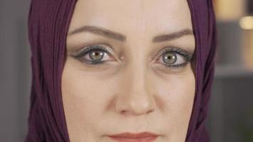 Eyes. Close-up green eyes of woman in hijab. Close-up portrait of woman in hijab. video