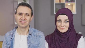 Portrait of happy muslim couple. Smiling Muslim family looking at camera. video