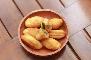 Comro or combro, a traditional Javanese snack made of deep fried grated cassava filled with a savory mix of oncom or fermented soy bean cake and chili photo