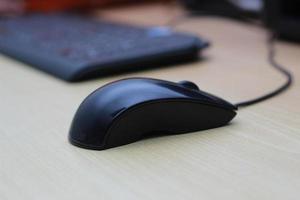 a photo of a black mouse and keyboard to work with. Technology equipment concept photo.