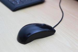 a photo of a black mouse and keyboard to work with. Technology equipment concept photo.