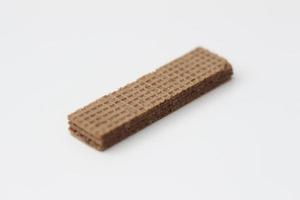 a close up of chocolate wafers isolated on white background. photo