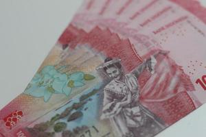 Indonesian rupiah banknotes series with the value of one hundred thousand rupiah IDR 100.000 issued since 2022. photo