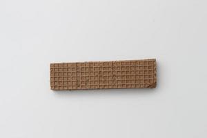 a close up of chocolate wafers isolated on white background. photo