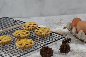 Small apple pie served on a cake rack, tastes sweet and savory. Food concept photo. photo