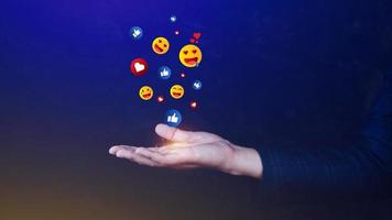 Social media and online digital concept, Businessman using  sending emojis with social media. People using and digital online marketing concepts photo
