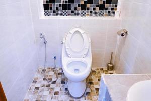 Toilet bowl in a modern bathroom ,flush toilet clean bathroom photo