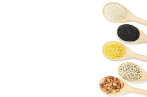 Collection set of beans and sesame on wooden spoons isolated on white background,top view photo
