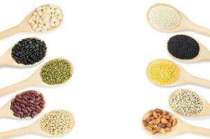 Collection set of beans and sesame on wooden spoons isolated on white background,top view photo