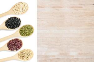 Collection set of beans and sesame on wooden spoons isolated on white background,top view photo