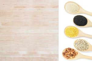 Collection set of beans and sesame on wooden spoons isolated on white background,top view photo