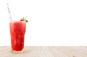 Strawberry juice smoothie in glass with fresh strawberry on wooden isolated on white background photo