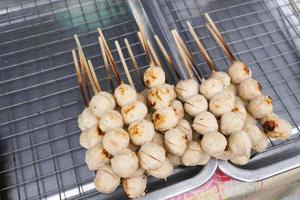 Street food meat ball sticks on grill at Thailand photo