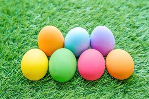 Colorful Easter eggs on green grass photo