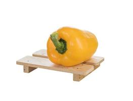 Fresh yellow bell peppers on white photo