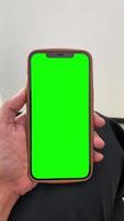 Green screen, vertical of green screen, green screen of phone, green screen mobile phone, hand holding mobile phone video